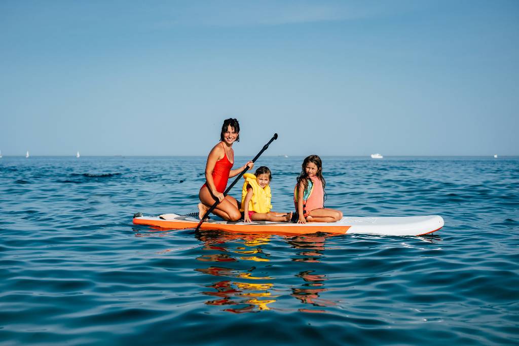 family paddleboarding in sarasota